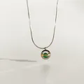 Saturn Planeten Anhänger Halskette mit grüner Perle und silberner Schlangenkette Collier - Goldener Rahmen Grüne Perle