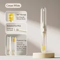Dual-headed ear and nose cleaner with silicone brush in cream white variant. - Ear Scoop Style / White