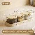 Khaki kitchen seasoning jar set featuring 3 clear containers, base and spoons. - 3-Piece Set with Base and Spoon / Khaki
