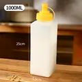 1000ml transparent plastic squeeze condiment bottle with yellow lid and dimensions 25x7.5cm - Large Condiment Bottle / Large Size 1000ml (1 Piece)