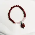 Rotes Zinnober-Perlenarmband im chinesischen Stil mit rosa Perlen und Glücksbeutel - Glückstasche Stil