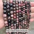 Vue détaillée de perles rondes en rhodonite naturelle à lignes noires de différentes tailles pour bijoux - 4mm (Env. 90 pcs/brin) / Rhodochrosite à Lignes Noires Naturelle