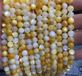 Perline rotonde in madreperla naturale gialla e bianca per la creazione di gioielli - Perline di Conchiglia Marina Gialle Naturali 7A