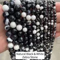 Gros plan de perles rondes en pierre zébrée naturelle noire et blanche pour bijoux DIY - 4mm (Env. 90 pcs/brin) / Pierre zèbre noire et blanche naturelle