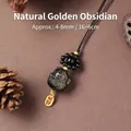 Glückskatze-Anhänger aus natürlichem Goldschein-Obsidian für Handy oder Tasche mit Kordel - Natürlicher Goldener Obsidian Glückskatze Handy-Anhänger