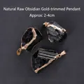 Pendentif en pierre brute d'obsidienne noire naturelle avec bordure dorée élégante - Pendentif en Obsidienne Naturelle Bordé d'Or / Noir