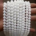 Close-up view of strands of polished white porcelain glass beads for DIY jewelry making - 6mm / 60Pcs Set / Porcelain White