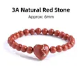 Natuurlijk rood jaspis kralenarmband met 6 mm stenen en een hartvormig middenstuk - Rode Jaspis