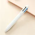 Close-up of a minimalist white 6-in-1 multicolor ballpoint pen on a pastel tray - 6-in-1 Multi-Color Ballpoint Pen / White / 0.5mm