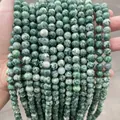 Vue détaillée de perles de pierre naturelle marbrée vert et blanc pour bijoux DIY - 6mm (Environ 60 Pièces/Mèche) / Pierre à points verts naturels