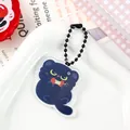 Close-up of cute acrylic black cat keychain with apple design for bag decoration - Eating Apple Kitty (2088)