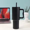 Matte black 40oz stainless steel vacuum insulated tumbler with handle and straw on a desk - 40oz / Black