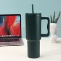 Detailed macro view of a matte dark green 40oz stainless steel insulated tumbler with handle and straw - 40oz / Dark Green