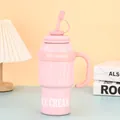 Side view of pink stainless steel tumbler with handle and straw and Ice Cream text - 1000ml / Pink