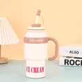 Close-up of large cream-colored insulated tumbler with 'ICE CREAM' print and handle. - 1000ml / Milky White