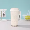 Cremefarbener Thermobecher mit Maiglöckchenmuster und gewebter Trageschlaufe - 500ml / Weiße Maiglöckchen