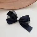 Close-up of black mesh bow hair clip featuring a delicate central pearl and tulle. - Polka Dot Four-Tail Bowknot Duckbill Clip (4#) / Black
