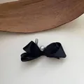 Macro view of an elegant black ribbon bow hair clip with mesh and a pearl center - Stereo Small Mesh Bowknot Duckbill Clip (3#) / Black