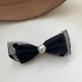 Close-up detail of an elegant black mesh polka dot bow hair clip with a white center pearl - Polka Dot Double-Layer Bowknot Spring Clip (1#) / Black