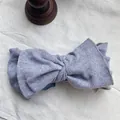 Close-up of retro lavender ribbed knit large bow headband with soft elastic texture. - Light Gray