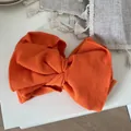 Vintage oversized orange ribbed cotton bow headband for women featuring elastic wide band - Orange
