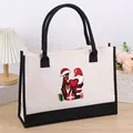 Close-up view of large canvas tote bag featuring festive Christmas LOVE print - LOVE
