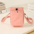 Pink nylon lightweight drawstring crossbody phone bag with adjustable shoulder strap - Pink