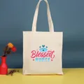 Bolso tote de lona de algodón blanco roto con un estampado gráfico artístico rosa 'Blessed Nurse' - 35*39cm / Nurse-9