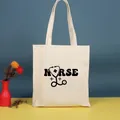 Elegante bolso de lona crema con diseño gráfico negro de 'NURSE' y un estetoscopio - Estampado de Estetoscopio NURSE (Nurse-30) / 35*39cm / Nurse-30