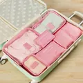 6-piece pink travel organizer set neatly arranged inside a mint green suitcase setup - 6-Piece Set / Pink