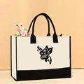 Premium cream canvas tote bag featuring black trim and wildflower print graphics - 43*13.5*30.5 / She Is A Wildflower (Mother-62)