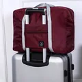 Waterproof wine red foldable travel bag featuring a convenient luggage handle sleeve - Second Generation / Burgundy