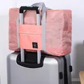 Large capacity pink waterproof foldable travel duffel bag with luggage trolley sleeve - Second Generation / Pink