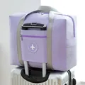 Purple waterproof foldable travel bag with luggage handle sleeve for easy travel. - Round Logo Bag / Purple