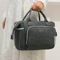 Durable gray insulated mommy bag featuring large capacity and mesh side pocket storage - Gray