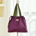 Large purple waterproof twill foldable travel storage bag with drawstring and green handles - Large Drawstring Bag / Purple