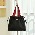 Large black and red waterproof twill travel storage bag for luggage organization - Large Drawstring Bag / Black