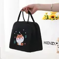 Black insulated lunch bag featuring a cute cartoon Shiba Inu print for picnic use. - Black