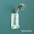 Wall-mounted universal adjustable shower head holder in mint green finish with dual hooks - Strong Adhesive Backing / Green