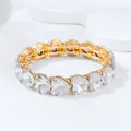 Elegant gold-tone elastic bracelet featuring heart-shaped clear faceted crystals - Heart Bracelet / White