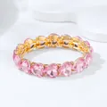Fashionable elastic gold-toned bracelet featuring radiant pink heart-shaped crystal stones - Heart Bracelet / Pink