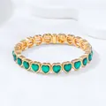 Elegant gold-tone heart bracelet with vivid green gemstones, luxury fashion accessory. - Green Heart Link / Green (KC Gold)