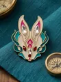 Detailed view of original rabbit zodiac alloy brooch with teal enamel and red rhinestones - Rabbit