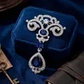 Broche vintage de style royal avec goutte bleue, alliage d'argent et strass brillants - Argent Verre Bleu
