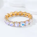 Fashionable gold-tone elastic bracelet featuring iridescent heart-shaped acrylic crystals - Heart Bracelet / AB Color