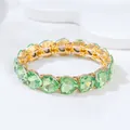 Fashionable gold-toned stretch bracelet with green acrylic heart crystals - Heart Bracelet / Light Green