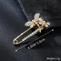 Detailed view of rhinestone dragonfly safety pin brooch with 4.0x2.0cm dimensions - 4.0cm x 2.0cm