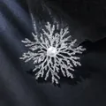 Macro detail of snowflake brooch featuring textured silver branches and central white pearl - Silver & White Pearl Snowflake