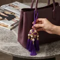 Handmade purple ethnic embroidered ball tassel bag charm with elegant pearls and crystals. - Lanyard / Purple