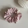 Close-up detail of a sweet pink striped Korean style scrunchie with fabric tag. - Pink Striped Scrunchie / Pink